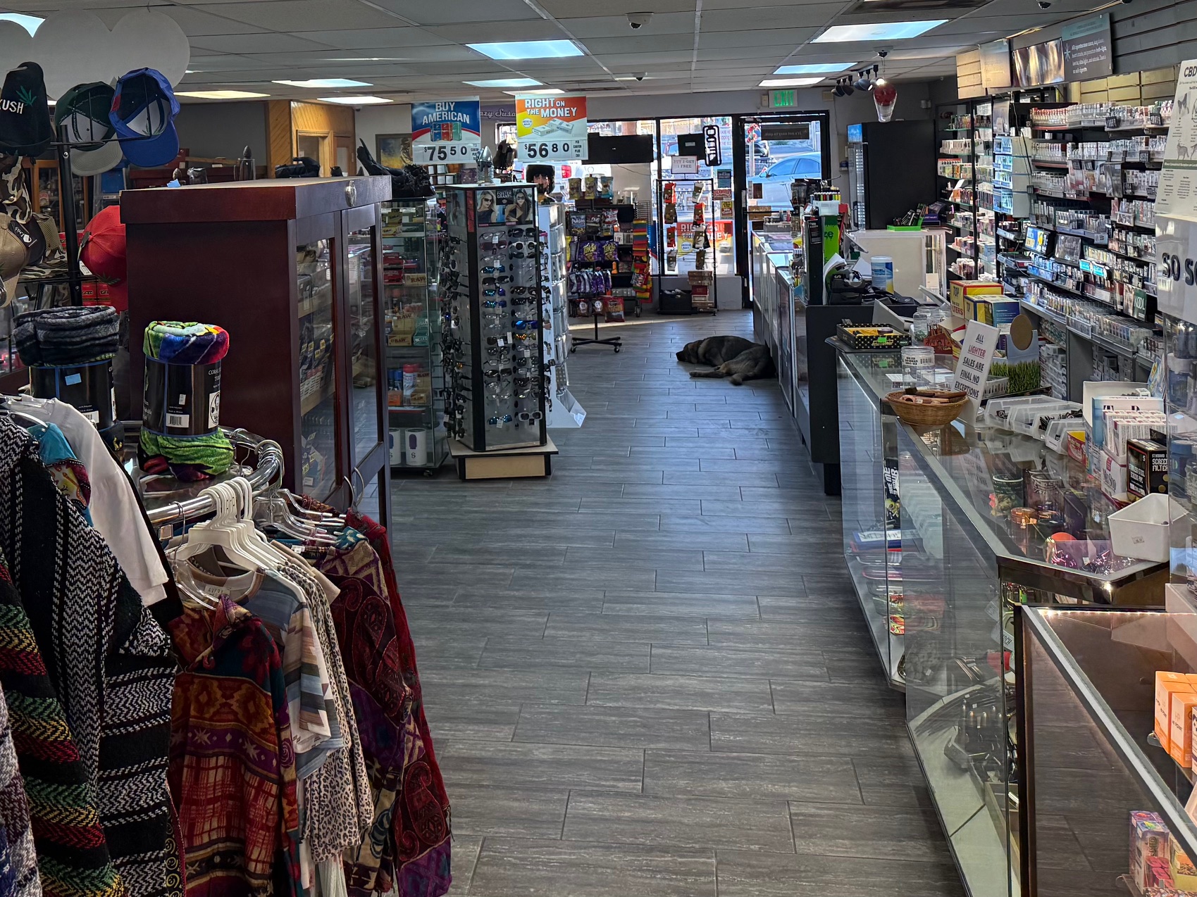 Center aisle with hanging tapestries and apparel