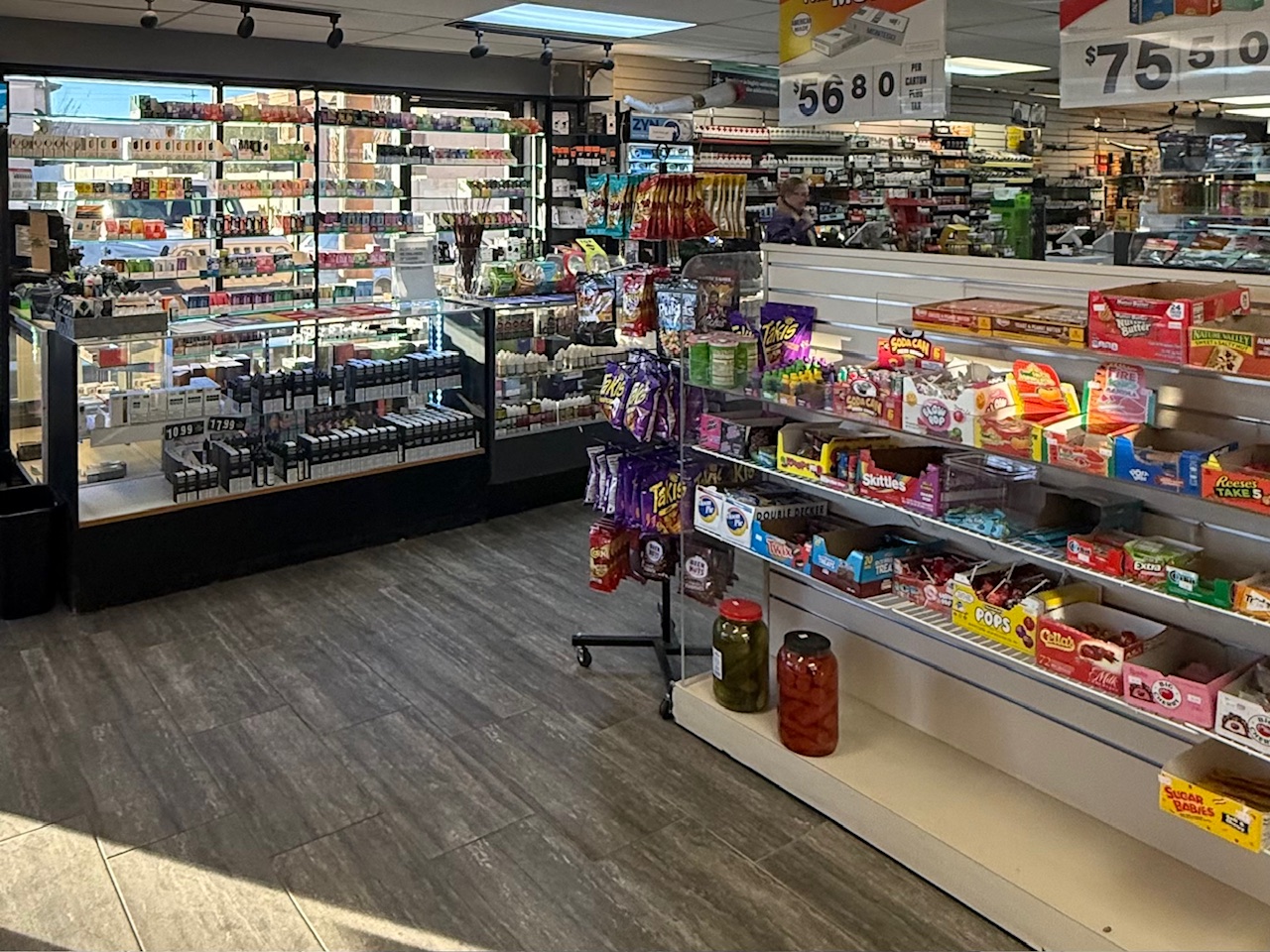 Wall of vape devices and flavored options at Frontier Tobacco