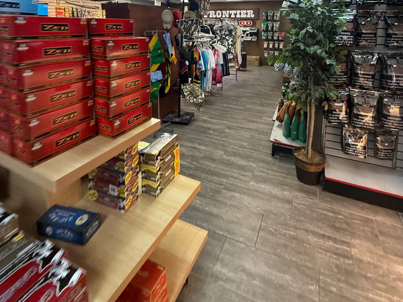 Cigar boxes and chew display stacked on wooden shelves
