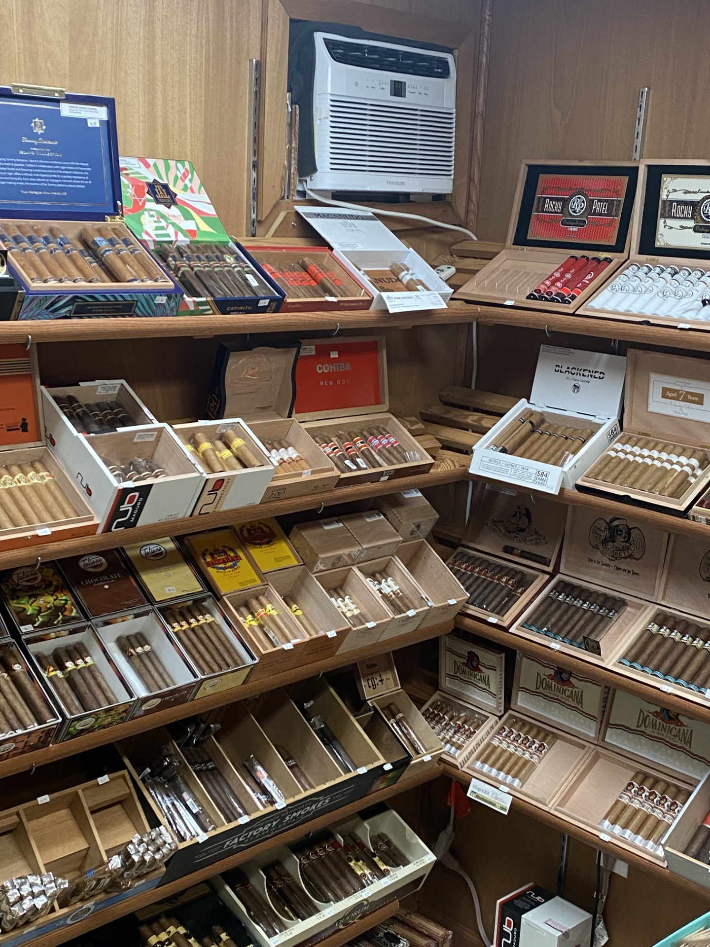 Humidor shelves stacked with premium cigar boxes