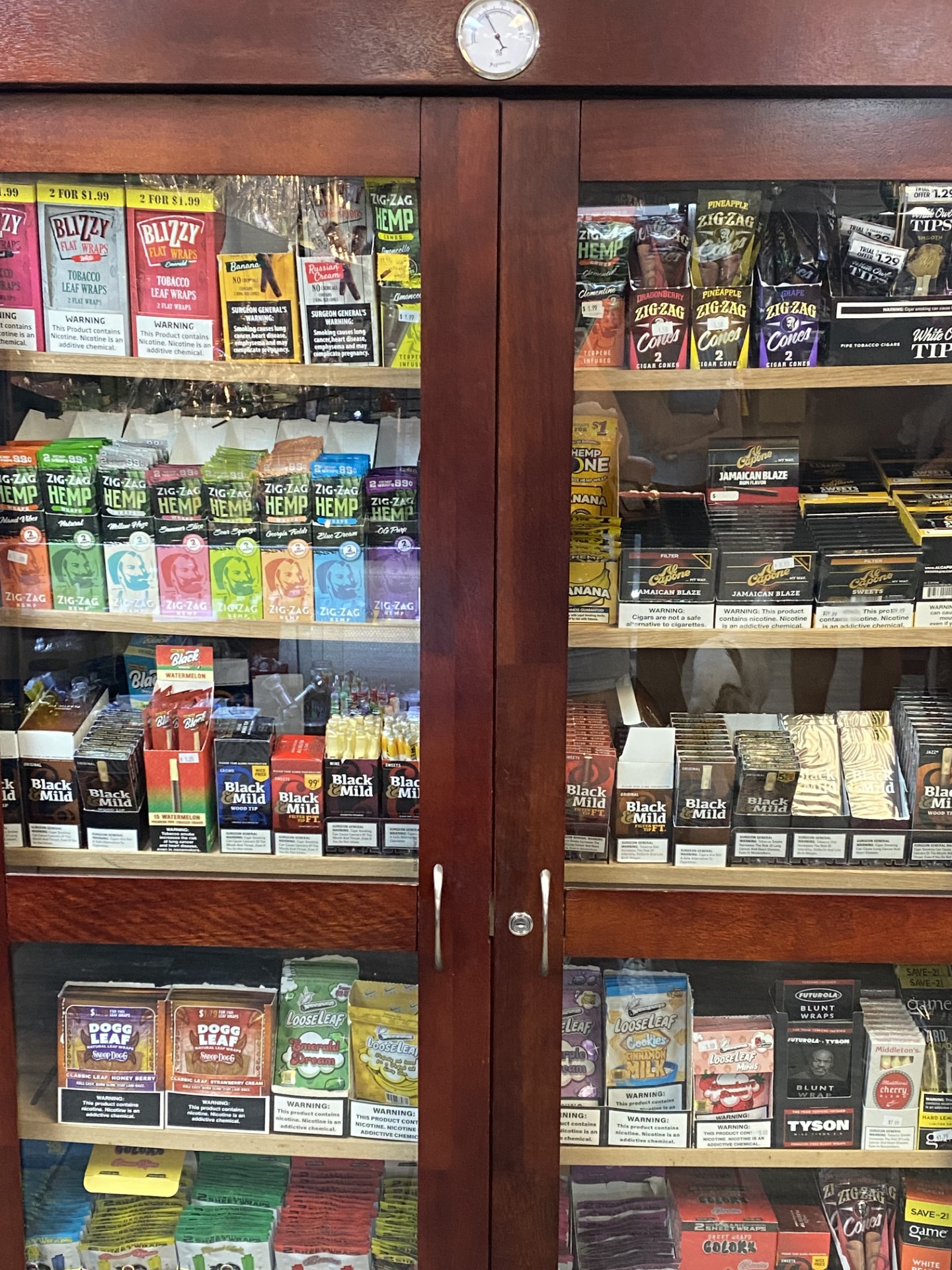 Case of wraps, cones, and Black & Mild cigarillos
