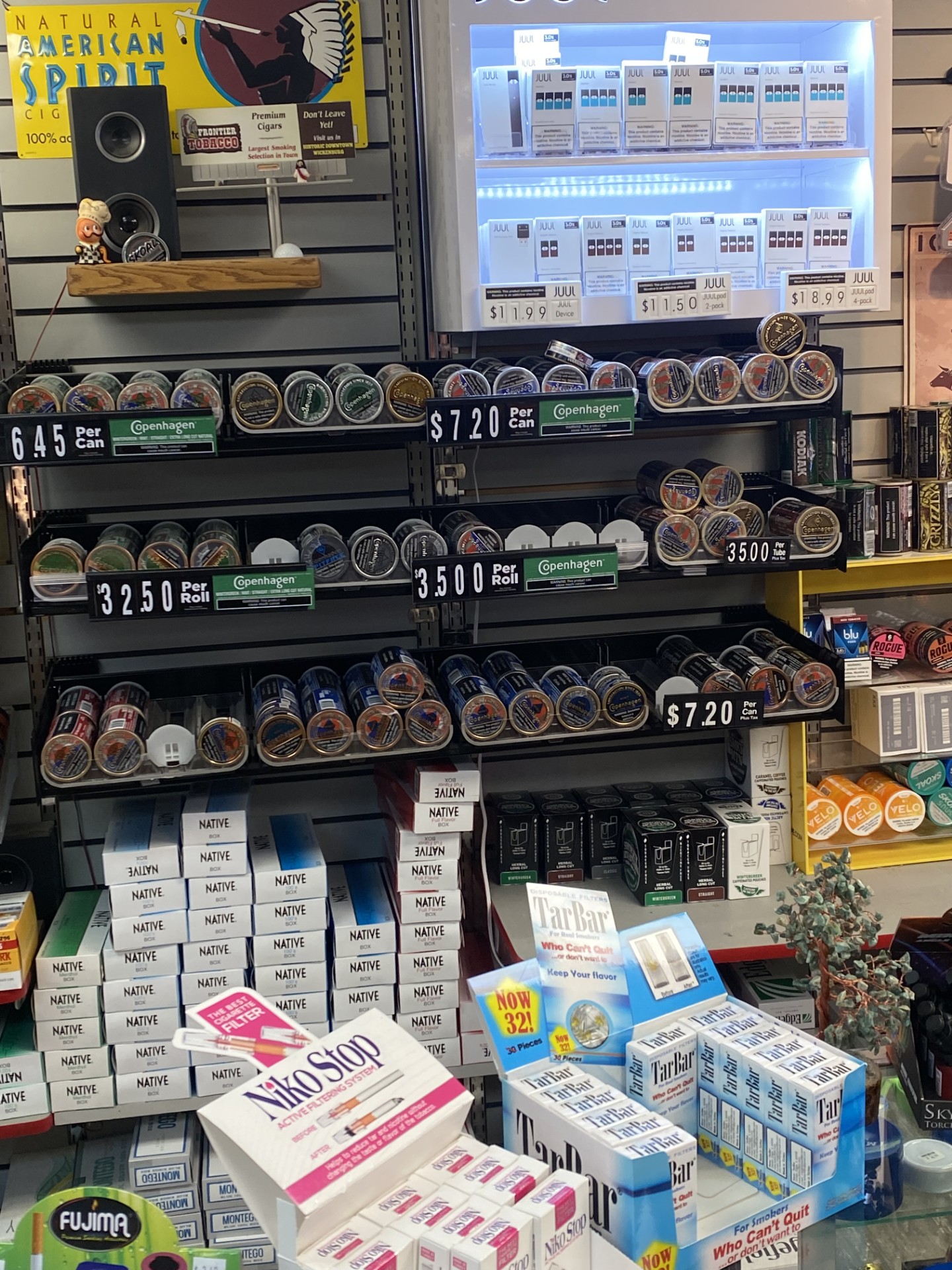 Smokeless tins, JUUL case and Frontier Tobacco sign