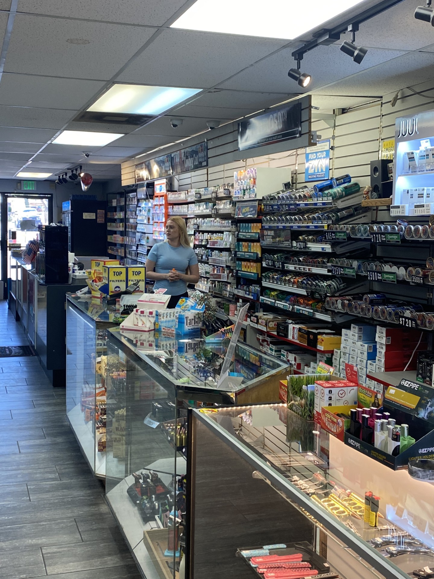 Wide interior view down the length of the Frontier Tobacco counter